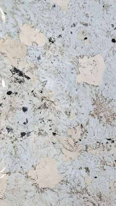 Close-up shot of an Alpine natural stone slab featuring a polished crystalline white background with dramatic brown veins, sold by EtternaG.